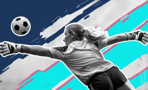 a san diego wave fc goalie soccer player diving to catch the ball