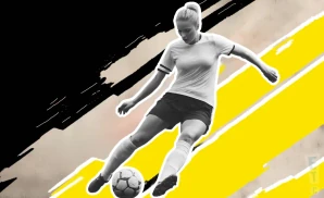 a washington spirit soccer player kicking the ball down field