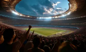 Soccer stadium packed with cheering fans under a cloudy sky.