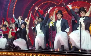 the cast of moulin rouge the musical together for curtain call.