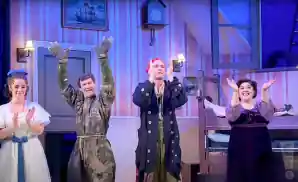 the cast of peter pan goes wrong together for curtain call.