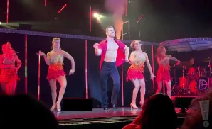 derek hough dancing live in red sparkly shirt.