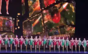 dancers dancing on stage in radio city rockettes show.