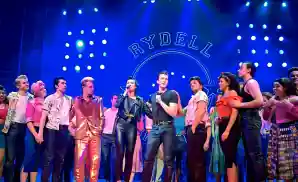 cast of grease at curtain call at the dominion theatre in london, england.