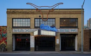 Antonine's Music Venue, with a neon longhorn sign and marquee, in Austin, Texas.