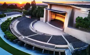 An aerial view of an outdoor amphitheater at sunset.