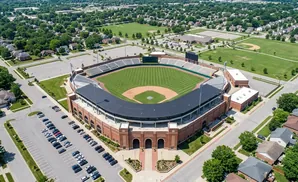 Aerial view of a baseball stadium surrounded by a neighborhood and parking lots.