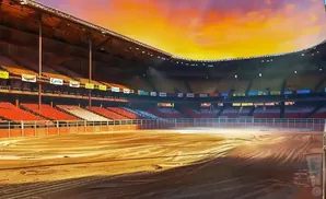 Empty rodeo arena with stadium seating under a dramatic sunset sky.