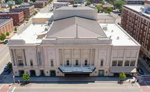 Aerial view of the Lerner Theatre, a grand building with classical architecture and a prominent marquee.
