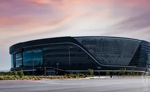 Allegiant Stadium, home of the Las Vegas Raiders, at sunset.