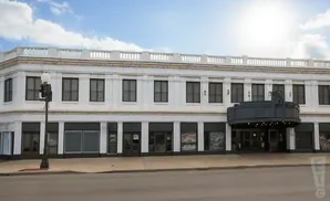 Art Deco building with a prominent marquee and upper-level windows.