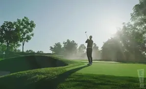 A golfer swings at a sun-drenched golf course, with trees and a hazy sky in the background.
