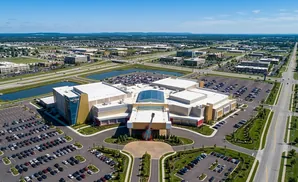 Aerial view of the Hard Rock Casino with a large guitar statue in front, surrounded by parking lots and roads.