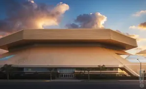 Golden, futuristic building with layered roof under a cloudy sunset sky.