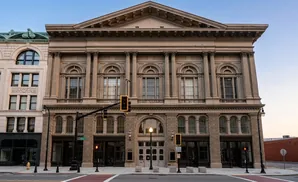 Ornate classical building with multiple windows and columns.