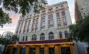 A historic theater building with ornate architecture and a marquee.