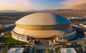 An aerial view of the spherical Thomas & Mack Center arena in Las Vegas at sunset.