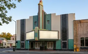 Art deco theater with marquee and colorful vertical accents.