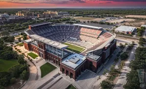 Aerial view of Kyle Field stadium in College Station, Texas, at sunset.