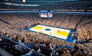 Fans cheer during a Golden State Warriors basketball game at their arena.