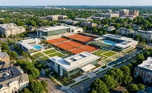 Aerial view of a modern sports complex with tennis courts, a swimming pool, and surrounding buildings and trees.