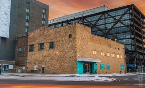 a cinematic ultra-realistic photograph of the 9:30 club in washington, d.c., captured at sunset.