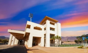 an exterior promotional venue picture of alex g spanos stadium with a sunset sky