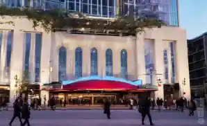 an exterior picture of the alex theatre glendale from across the street during sunset