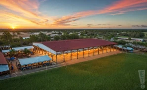 a photograph of the bergeron rodeo grounds in davie, florida, captured at sunset. 