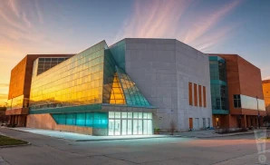 a photograph of the bmo harris bank center in rockford, illinois, captured at sunset. 