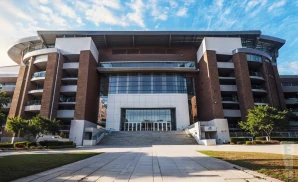 an exterior promotional venue picture of bryantdenny stadium with a sunny sky