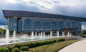 an exterior promotional venue picture of byers theatre at sandy springs performing arts center with a sunset sky