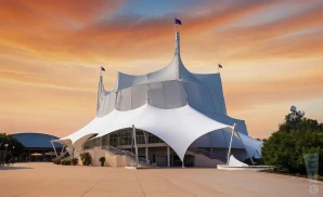 a cinematic photograph of the cirque du soleil building at disney springs in orlando, florida, captured at sunset. 