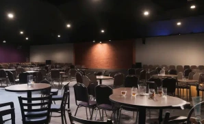 a realistic promo venue photograph of the comedy at the carlson at night. 