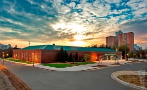 a promotional venue picture of the cool insuring arena taken from across the street during sunset 
