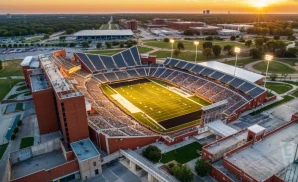 a hyper-realistic wide-angle aerial photograph of datcu stadium in denton, texas, captured at sunset.