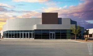 an exterior promotional venue picture of dollar loan center with a sunset sky