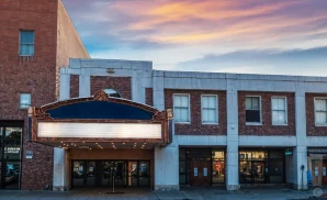 an exterior promotional venue picture of flynn center for the performing arts with a sunset sky