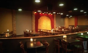 a realistic promo venue photograph of the funny bone comedy club hartford at night. 