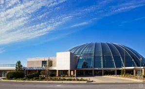 an exterior promotional venue picture of cadence bank center with a sunny sky