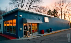 an exterior promotional photograph of the grey eagle, a live music venue located in asheville, north carolina, captured at sunset.