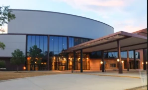 an exterior promotional venue picture of heymann performing arts center with a sunset sky