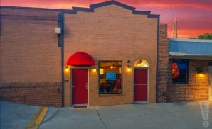 an exterior promotional venue picture of the improv comedy club - kansas city at sunset