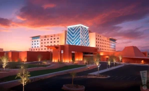 a promotional exterior photograph of the isleta casino & resort showroom in albuquerque, new mexico, taken at sunset.