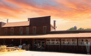 an exterior promotional photograph of knuckleheads saloon indoor stage in kansas city, mo, taken at dusk.