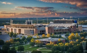 a realistic drone promo venue photograph of kroger field at sunset.
