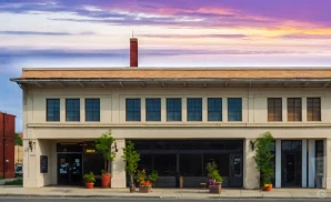 an exterior promotional venue picture of live at the ludlow garage with a sunset sky