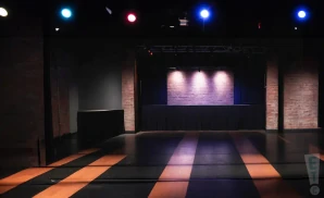 an interior promotional picture of the stage at miami improv