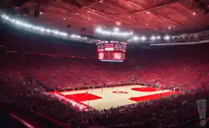 a realistic image of the basketball court at mullins center