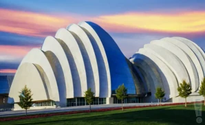 an exterior promotional venue picture of muriel kauffman theatre kauffman center for the performing arts with a sunset sky